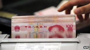 Yuan notes being counted