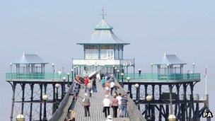 People enjoy warm weather on the Victorian Pier at Clevedon, North Somerset.