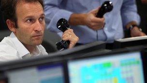 Trader watching stocks on screen