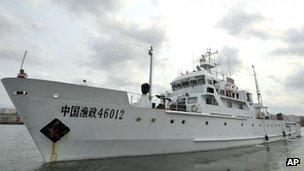 In this photo released by China's Xinhua News Agency, a Chinese fishery administration ship leaves the Xingang Port of Haikou, capital of south China's Hainan Province, Tuesday, March 26, 2013, to conduct patrol missions in waters off the Paracel Islands and Scarborough Shoal in the South China Sea.