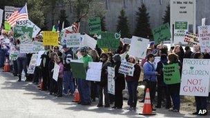 Residents demonstrate in favour of gun reform in Newtown, Connecticut, on 28 March 2013