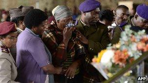 Relatives of the South African soldiers who died during a battle with rebels in the Central African Republic attend a memorial service at the Swartzkop Air Force Base in Pretoria on 2 April 2013