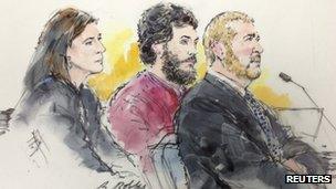 Colorado shooting suspect James Holmes and his public defenders Tamara Brady and Daniel King are pictured in a courtroom sketch during a hearing in Centennial, Colorado 1 April 2013