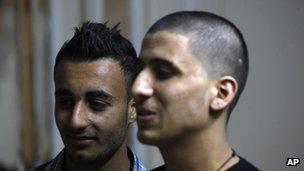 Ayman al-Sayed (right) says he was forced to shave his long hair by Hamas police - AP 7 April l 2013