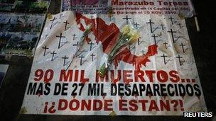 A banner decrying the high number of dead and missing during a march in Mexico City against violence in March 2013.