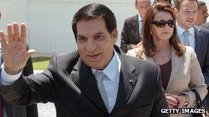 Former Tunisian President Zine el Abidine Ben Ali followed by his wife Laila Trabelsi