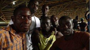 Group of immigrants from Senegal waiting for their visas
