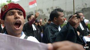 An Indonesian protester shouts slogans as religous leaders protest against Indonesian government failures to guarantee freedom of religion in Jakarta on 8 April 2013
