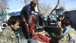 Afghan forces with the body of a comrade who was killed in Ghazni