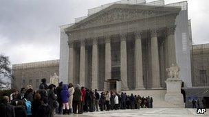 People wait to enter the US Supreme Court, February 2013