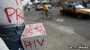 A Ghanaian volunteer campaigning about HIV prevention in Accra, Ghana (Archive shot: 2006)