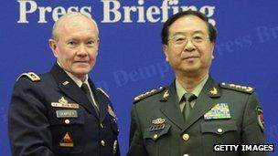 US Joint Chiefs Chairman Gen. Martin Dempsey (L) shakes hands with Chinese couterpart Gen. Fang Fenghui during their press briefing at the Bayi Building on 22 April 2013 in Beijing, China