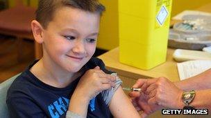 Boy getting measles jab