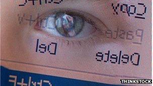 Eye reflected in computer screen