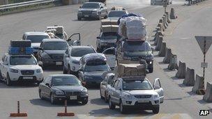 South Korean workers arriving from the Kaesong joint industrial complex in North Korea, 27 April 2013