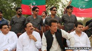 Imran Khan at a rally with his bodyguards