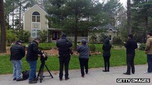 News media wait outside the home of Warren and Judith Russell, where their daughter Katherine Tsarnaeva, the widow of Tamerlan Tsarnaev, is staying 23 April 2013