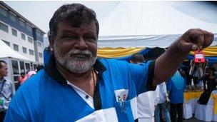 Marimuthu Seeniueasan, a Barisan Nasional supporter, with his new apartment keys