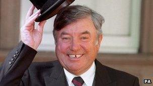Comedian Jimmy Tarbuck at Buckingham Palace after receiving his OBE