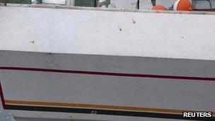 Bullet holes on the Guang Ta Hsin 28 are circled in yellow