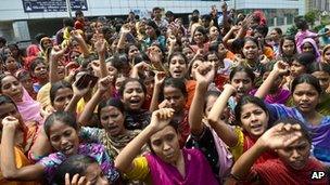Garment workers shouts slogans during a protest for better working conditions more than a week after the collapse of Rana Plaza on 5 May