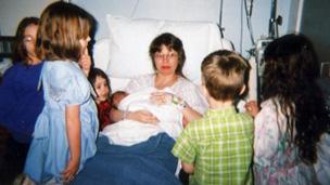 Vyckie Garrison and her children after the birth of her youngest child