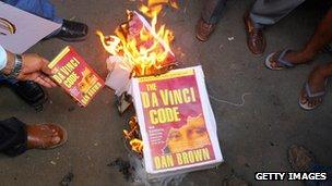 Indian Christian protestors burn a copy of The Da Vinci Code in Mumbai in 2006