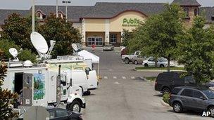 Satellite trucks line the parking lot where the highest Powerball jackpot worth an estimated $590.5 million was sold recently at this Publix supermarket located in Zephyrhills, Florida 19 May 2013