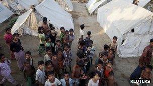 Rohingya Muslims pass the time at a camp for people displaced by violence, near Sittwe 26 April 2013