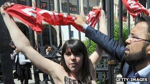 A Femen protester takes part in a demonstration in support of activist Amina Tyler outside a courthouse in Tunisia
