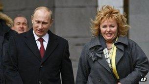 Russian Prime Minister and presidential candidate Vladimir Putin, left, and his wife Lyudmila arrive at a polling station in Moscow in March 2012