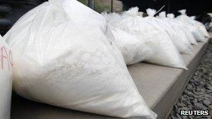Bags containing cocaine are displayed during a drug incineration in Lima on April 18, 2013