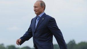 Russia's President Vladimir Putin walks for the official arrivals for the start of the G8 Summit in at the Lough Erne resort near Enniskillen in Northern Ireland 17 June 2013