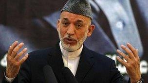Afghan President Hamid Karzai speaks during a news conference, 18 June