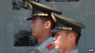 Chinese paramilitary officers patrol outside the North Korean embassy in Beijing on June 19, 2013