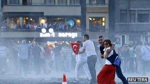 Riot police use water cannon in Taksim Square, 22 June