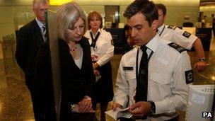 Home Secretary Theresa May meets passport officials at Heathrow in 2010