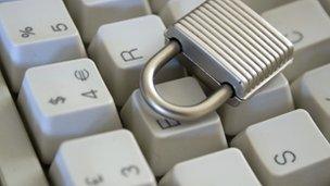 Lock sitting on computer keyboard