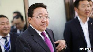 Tsakhia Elbegdorj arrives at a polling station to cast his vote during Mongolia's presidential elections in Ulan Bator, 26 June 2013
