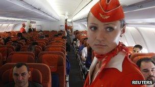 People onboard an Aeroflot Airbus A330 plane heading to the Cuban capital Havana at Moscow's Sheremetyevo airport on 27 June 2013