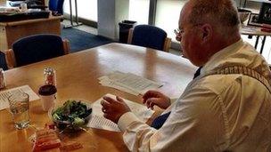 Eric Pickles eating a salad as he puts the final touches to his LGA speech