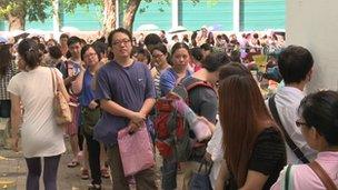 Parents waiting for results of their children's admission to a school in Hong Kong