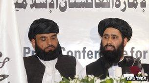 Muhammad Naeem (right), a spokesman for the Office of the Taliban of Afghanistan speaks during the opening of the Taliban Afghanistan Political Office in Doha on 18 June 2013