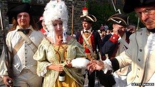 Re-enactors portray Marie-Antoinette at her beheading during Philadelphia's annual Bastille Day celebration in 2004