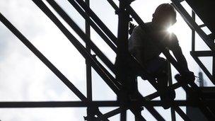 Construction worker on scaffold