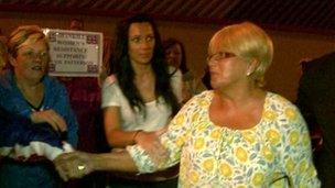 Ruth Patterson is greeted by supporters as she leaves police station