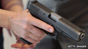 A man holds a pistol at a Utah concealed carry permit class in a December 2012 file photo