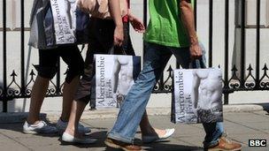 People walking with Abercrombie and Fitch bags