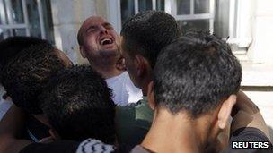 Grieving Palestinians at hospital in Ramallah