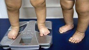 Children's feet on weighing scale